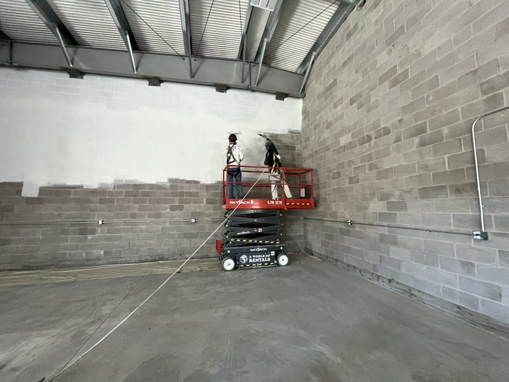 Commercial painting crew spraying