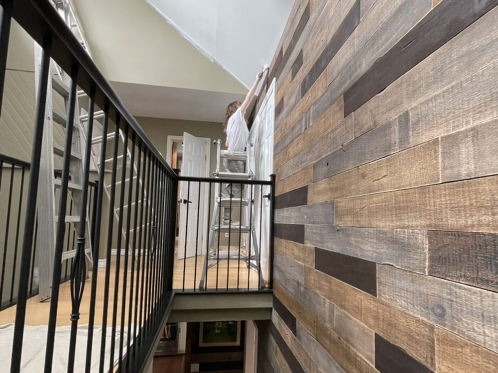 Reclaimed wood feature wall and stair railings